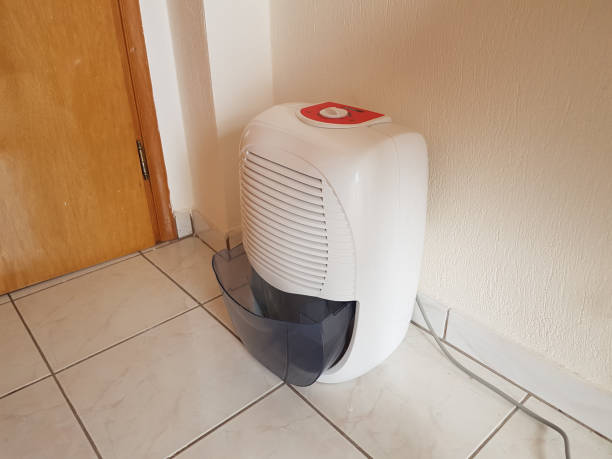 istock dehumidifier  in the room on the floor white red plastic 938594766