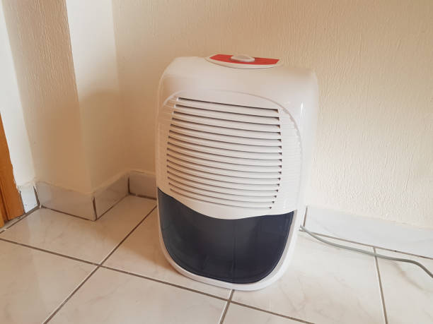 istock dehumidifier  in the room on the floor white red plastic 938597182