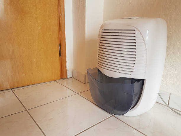 istock dehumidifier  in the room on the floor white red plastic 938597542