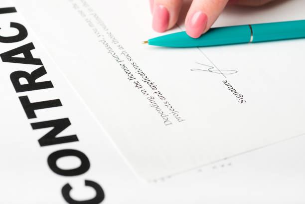 istock Businesswoman's hand with pen signing a contract. 938598072