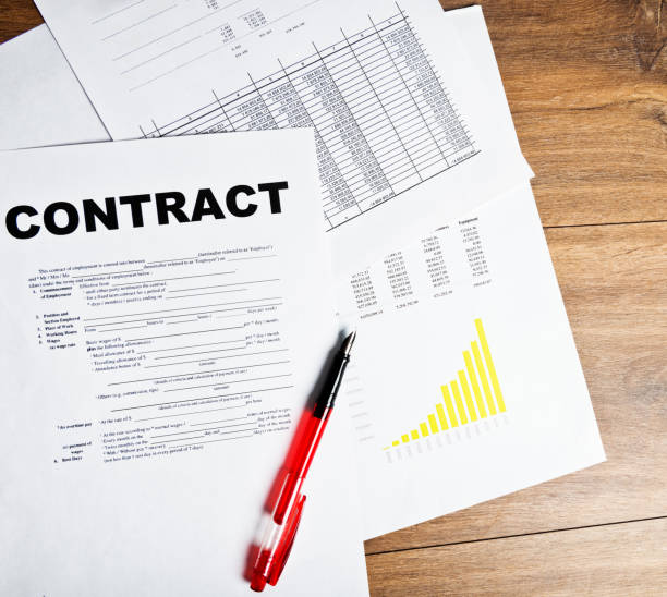 istock Pen and contract papers on wooden desk 938598372