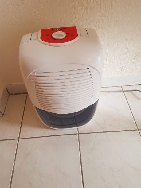 istock dehumidifier  in the room on the floor white red plastic 938598406