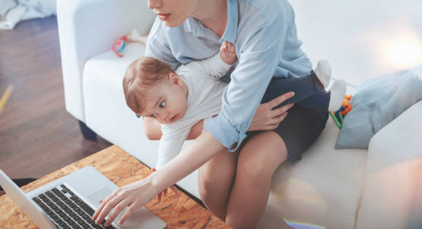 istock Cute nice child looking at the laptop screen 938598598
