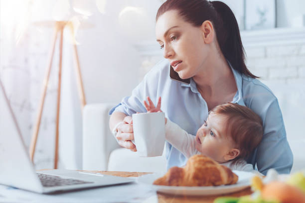 istock Serious attractive woman holding a cup with tea 938598848