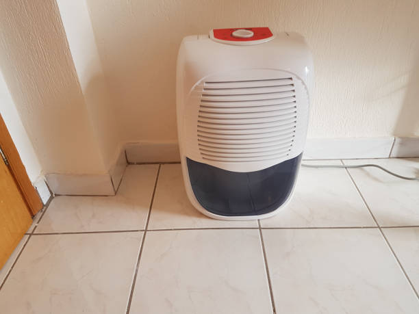 istock dehumidifier  in the room on the floor white red plastic 938598954