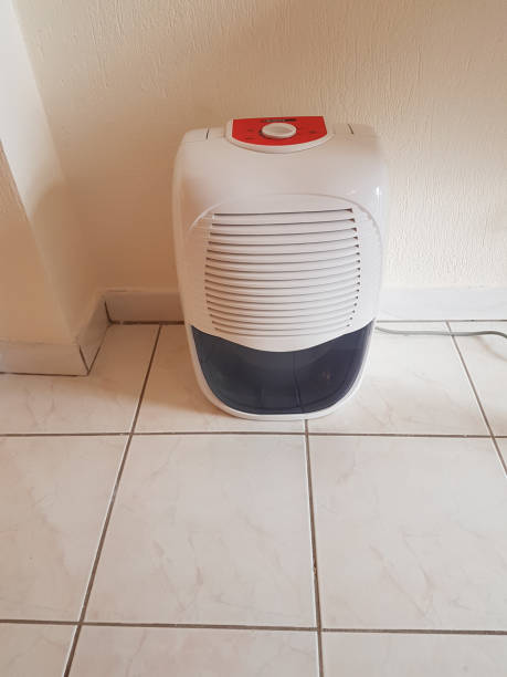 istock dehumidifier  in the room on the floor white red plastic 938598964