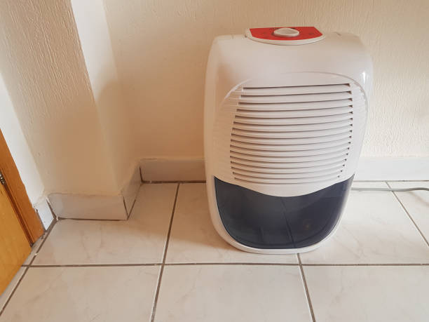istock dehumidifier  in the room on the floor white red plastic 938599200