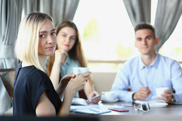 istock Business meeting in a cafe young beautiful men 938604822