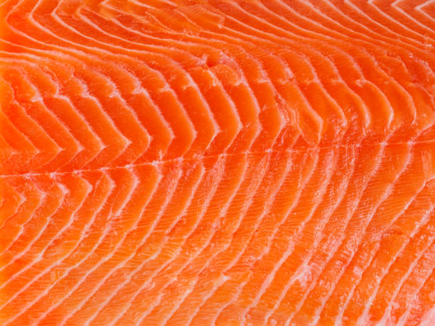 istock Fresh salmon fillet on white backgrund, close up, macro 938606564