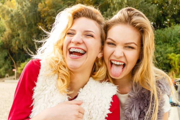istock Two crazy women having fun outdoor 938613726