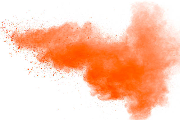 istock abstract orange dust explosion on white background. abstract orange powder splattered on white background, Freeze motion of orange powder splash. 938614516