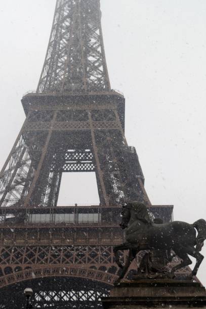 istock Eiffel tower of Paris with snow 938619222