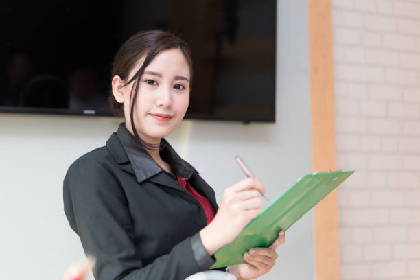 istock Business woman holding Folder tablet 938622282