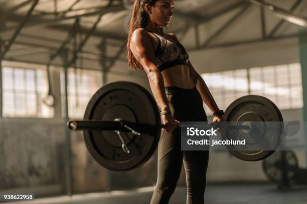 Determined And Strong Woman With Heavy Weights Stock Photo - Download Image Now - Weightlifting, Weight Training, Cross Training