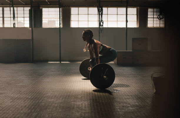 istock Fitness woman doing weightlifting exercise 938623274