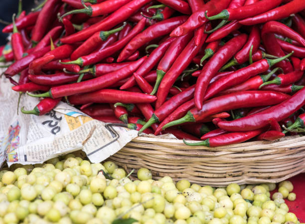 istock Bulk Red Chili Peppers in a basket 938624316