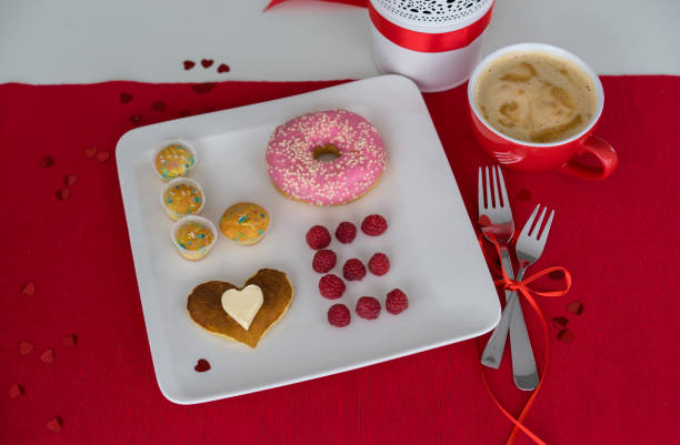istock composition for Valentine's day with berries, donut and pancakes 938626762