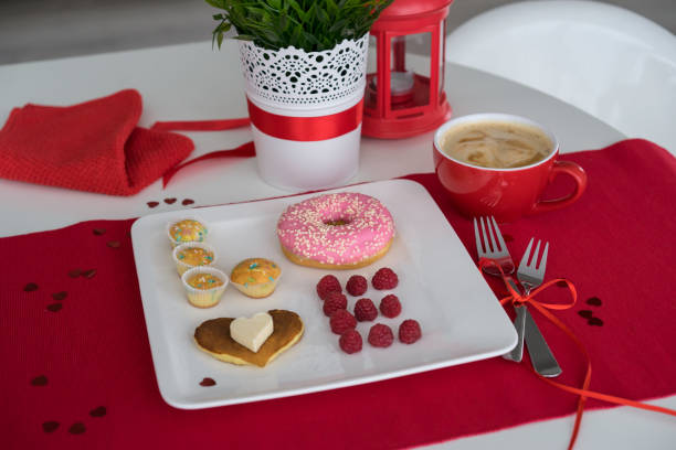 istock composition for Valentine's day with berries, donut and pancakes 938626788