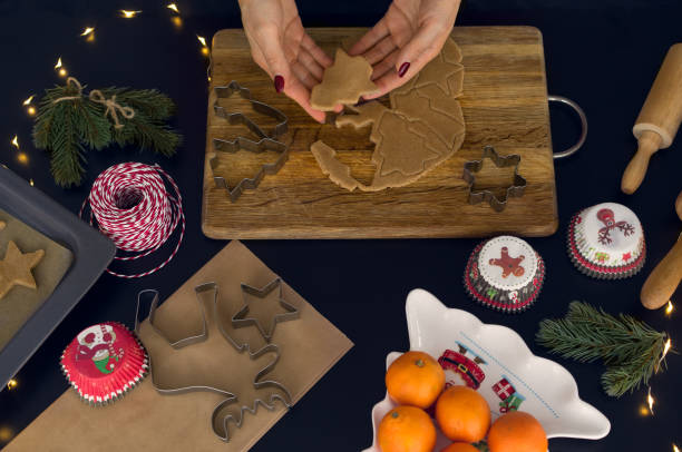 istock The recipe for making ginger biscuits. Rolls out the dough for ginger biscuits. 938627246