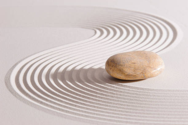 Japanese Zen garden with stone in textured sand
