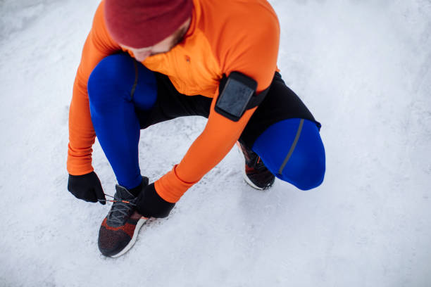istock Man tying sports shoes 938628114
