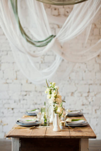 istock table appointments with flowers and white and green decorations 938629556