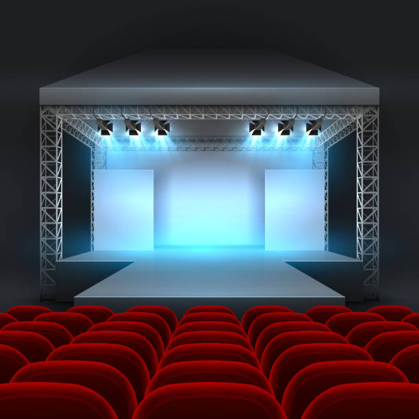 istock Empty theatre stage with spotlight lighting. Concert hall with podium and red seats rows 938635446