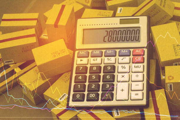 istock calculator with cardboard boxes products on wood pallet. Ideas for assembling a portfolio of assets which are held directly by investors. which expected return is maximized for a given level. 938635764