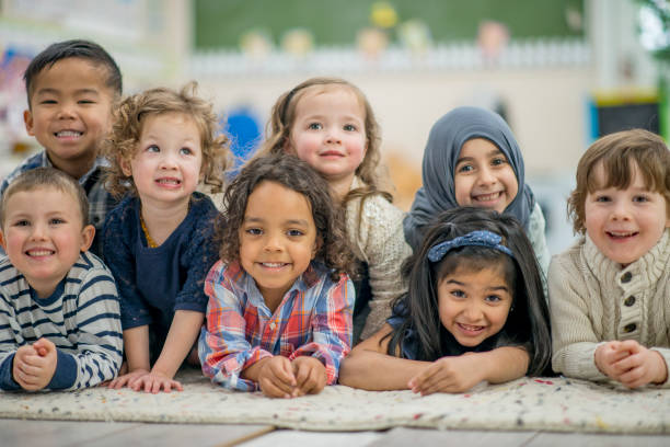 istock Ethnically Diverse Group of Kids Smiling Portrait 938637372
