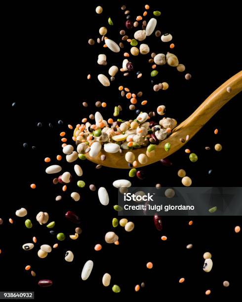 Splash Of Dried Vegetable Soup Stock Photo - Download Image Now - Legume Family, Black Background, Falling