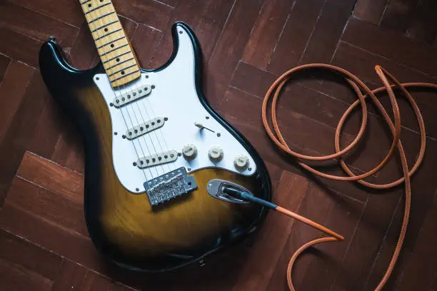 Photo of Electric Guitar on wooden floor