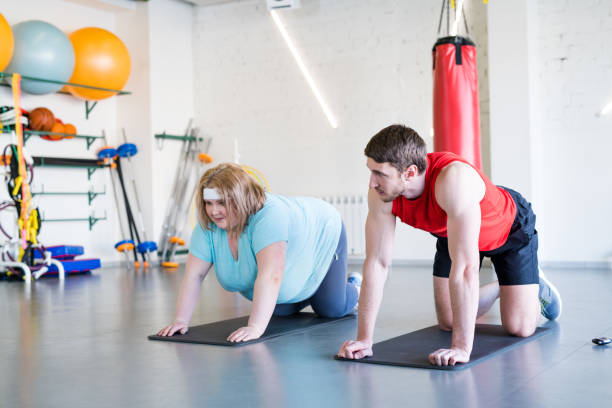 istock Obese Woman Working Out 938647542