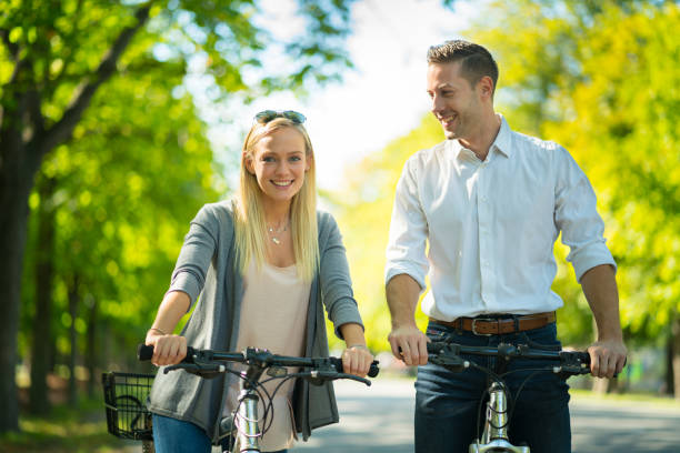 istock couple in urban park on their bikes 938647612