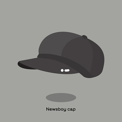 Grey fabric newsboy cap on light grey background. Casual cap with small brim in front like flat cap. This cap are also called baker boy, bandit cap, apple cap, eight piece cap.