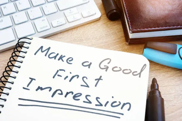 Photo of Make A Good First Impression handwritten in a notepad.