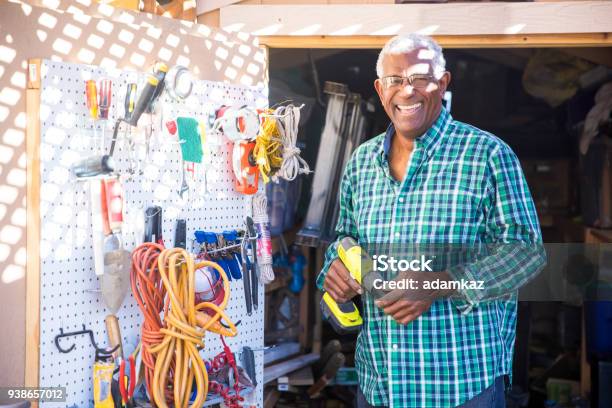 Senior Black Man In Tool Shed Stock Photo - Download Image Now - Pegboard, Gardening Equipment, Home Improvement