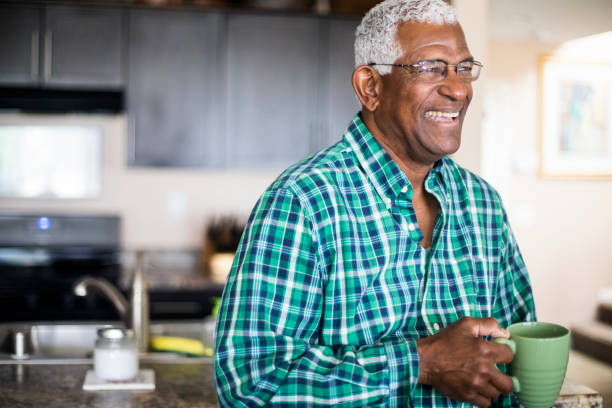istock Senior Black Man Drinking Morning Coffee at Home 938657048