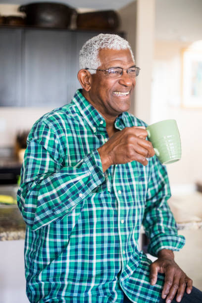 istock Senior Black Man Drinking Morning Coffee at Home 938657236