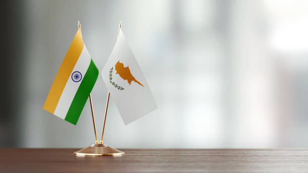 istock Indian And Cypriot Flag Pair On A Desk Over Defocused Background 938658142