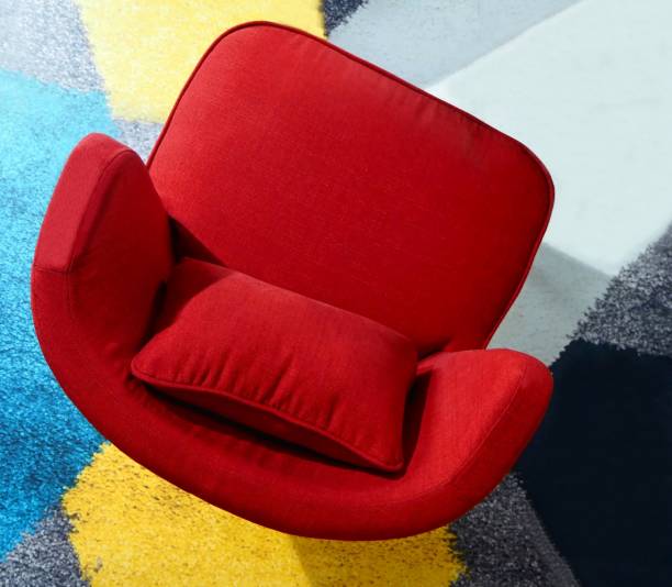 istock red armchair on a colorful carpet 938661904