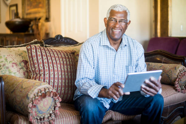 istock Senior Black Businessman Working From Home on Tablet 938666854