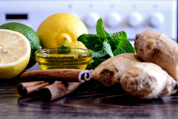 istock Drink from the lemon on the table. Lemon and ginger drink. 938670348