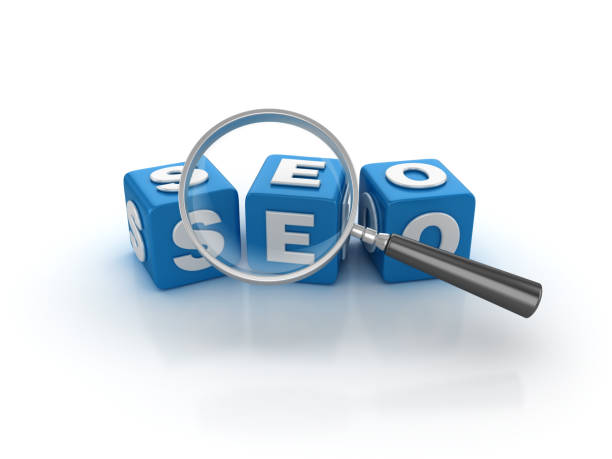 istock SEO Buzzword Cubes with Magnifying Glass - 3D Rendering 938676970