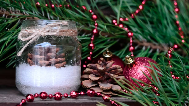 istock Candle on the table near the Christmas tree. Christmas present 938678714