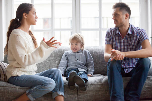 istock Frustrated little kid boy scared with mom and dad fighting 938682984