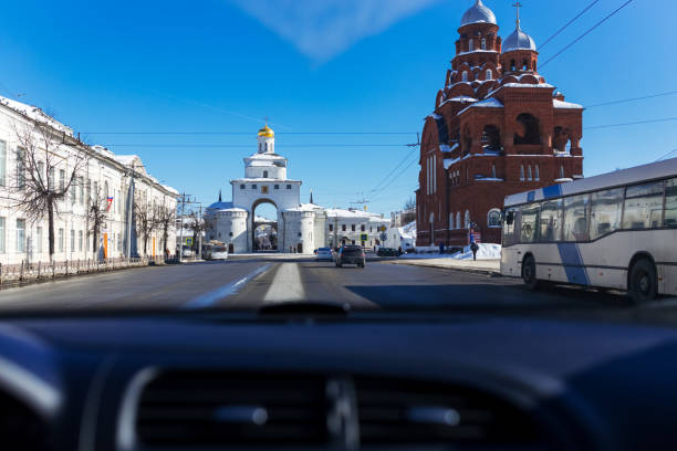 Golden Gate and Holy Trinity Church, famous landmarks of Vladimir city. View from car Vladimir, Russia - March 08, 2018: Golden Gate and Holy Trinity Church, famous landmarks of Vladimir city. View from car golden gate vladimir stock pictures, royalty-free photos & images