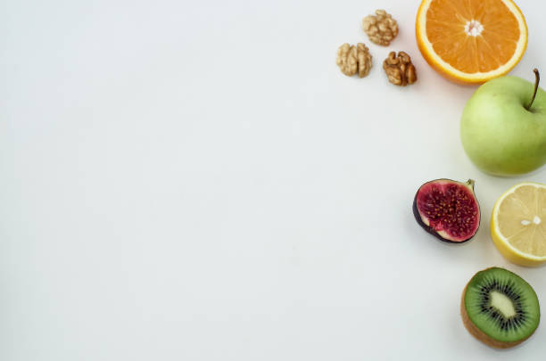 istock Background of fresh sliced fruit on a table in the afterno 938691442