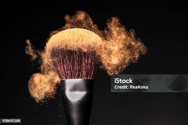 Face Powder In Motion On A Makeup Brush On A Black Studio Background Stock Photo - Download Image Now