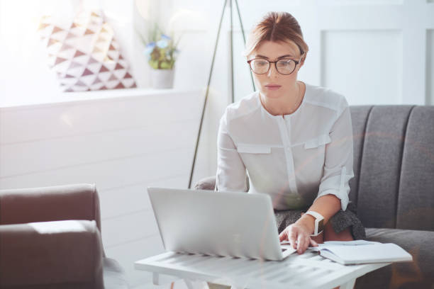 istock Attractive hard working businesswoman focusing on her work 938697862