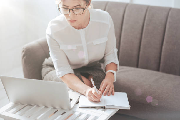 istock Beautiful modern businesswoman taking notes 938697882